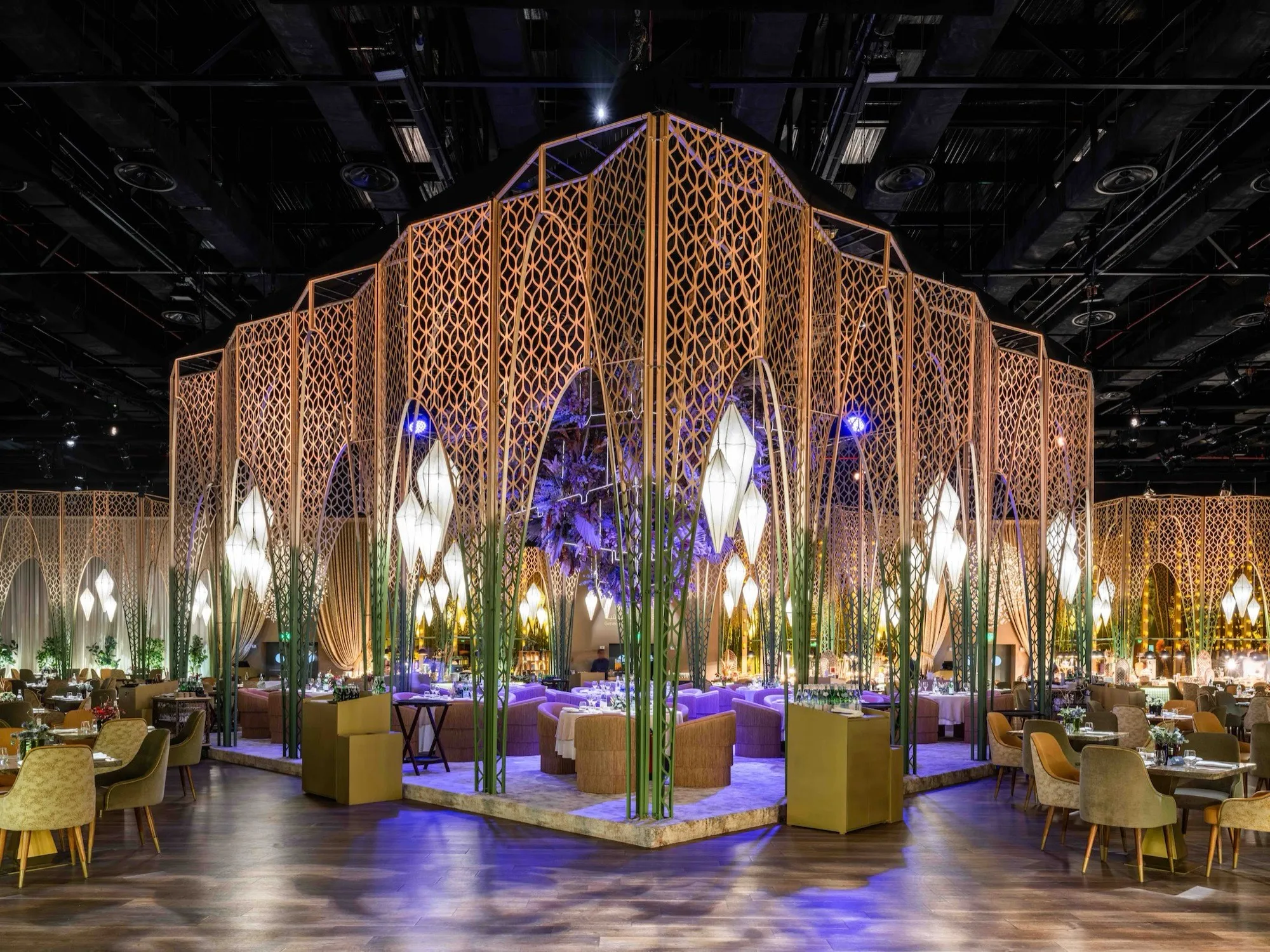 Gold lattice pavilion lit for an evening event