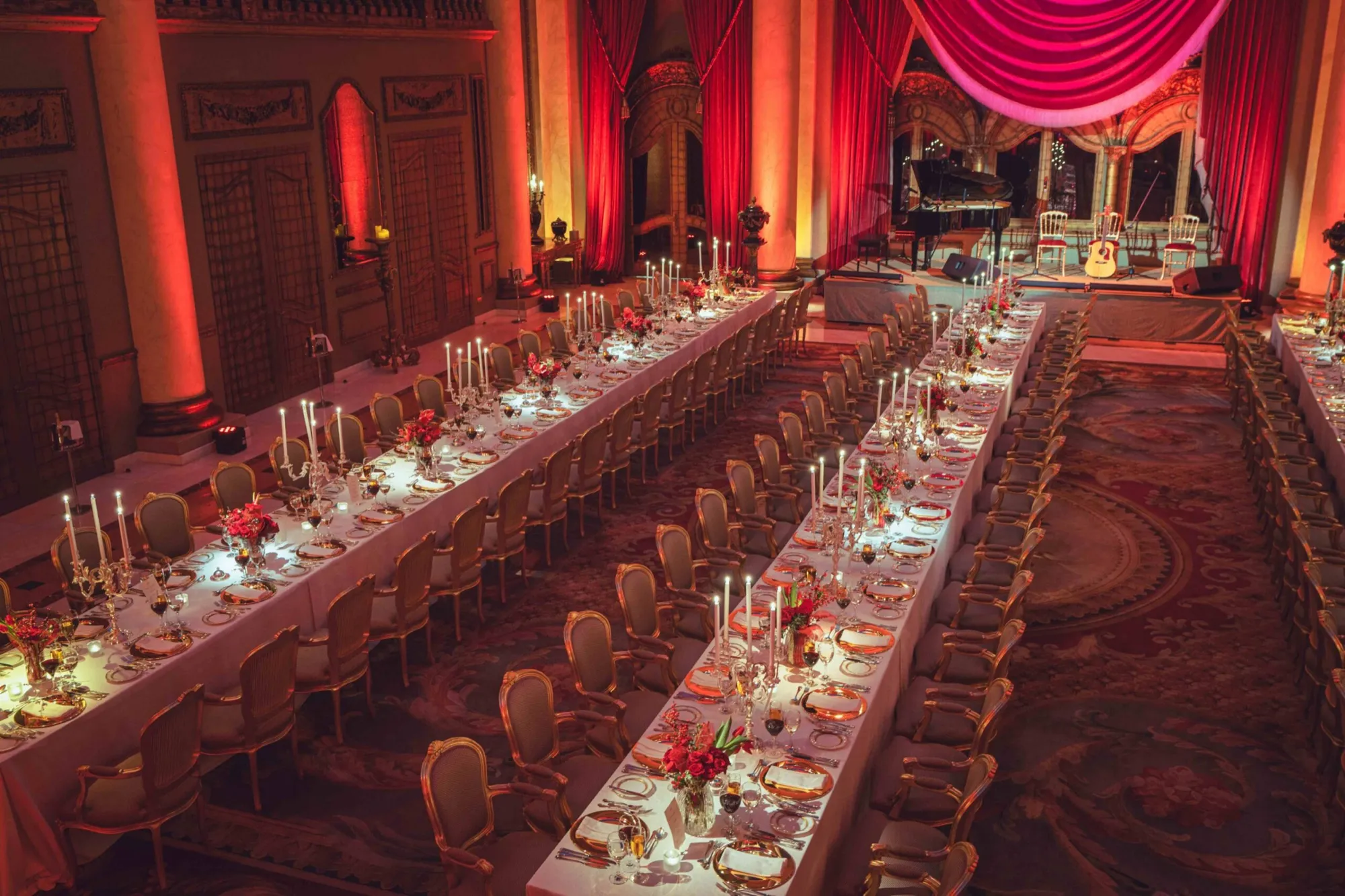 Long banquet table dressed in red for a celebration