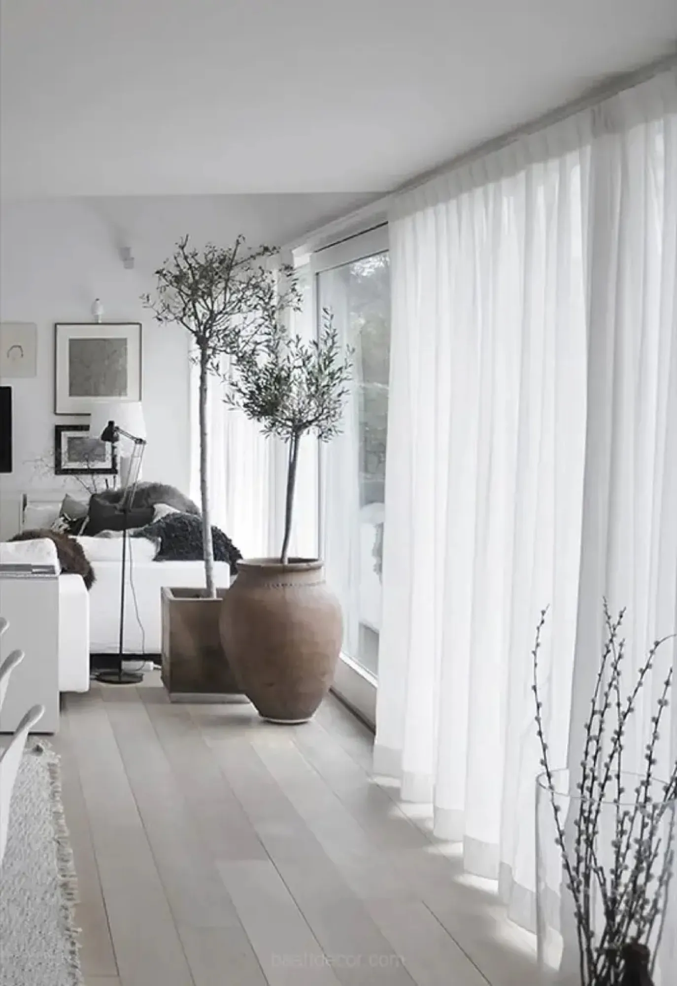 Sheer white curtains in a bright room